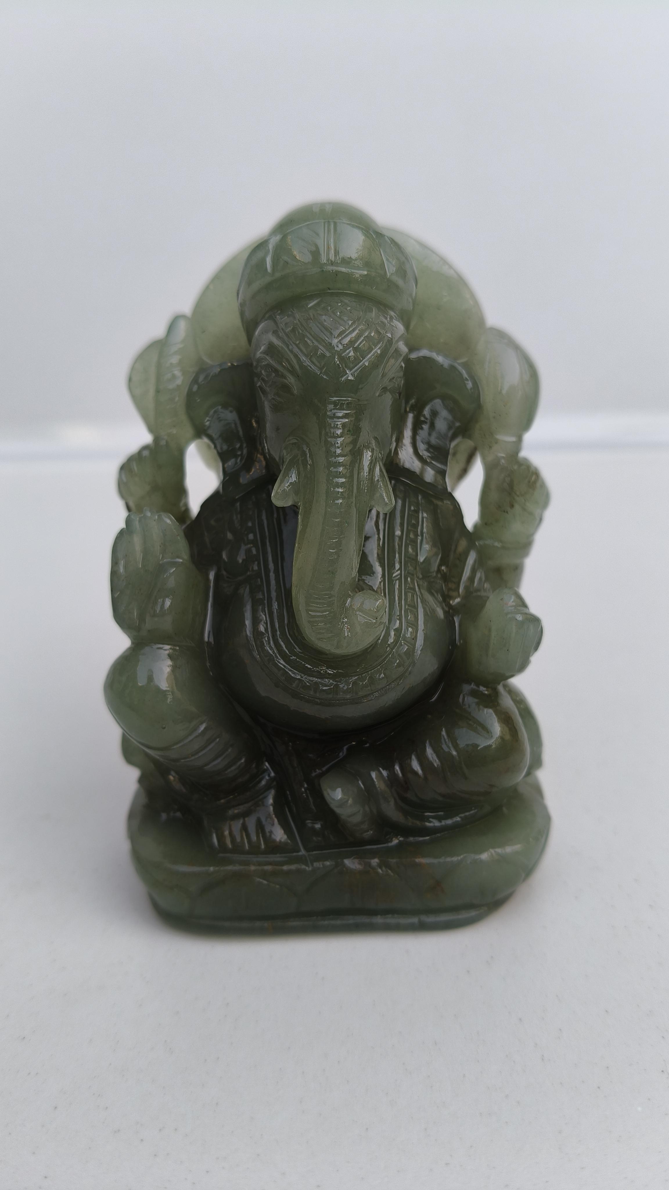 light green stone,jade ganesha,elephant deity,light green ganesha,crystal ganesha, handcraved ganesha,carving ganesha,crystal ganesha, elephant god, handcraved ganesha, hand carving ganesha,